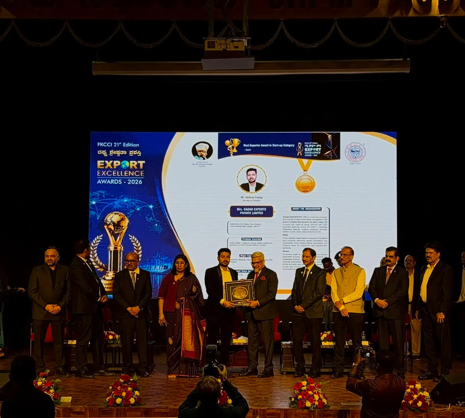 Gadag Exports receiving the FKCCI 21st Edition Export Excellence Award, Gold in the Start-up category, August 2026, with the citation naming the company on screen behind