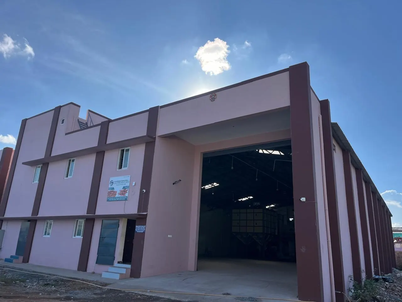 The Gadag Exports processing unit at Chennai, Tamil Nadu — a two-storey building with the company signboard and an open production bay
